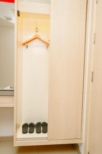 a cupboard with four black bowls in it at SLEEP WITH ME HOTEL design hotel @ patong (SHA Plus+) in Patong Beach