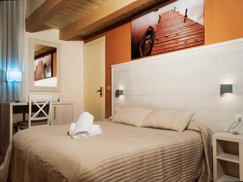 Posteľ alebo postele v izbe v ubytovaní Torre di Renda