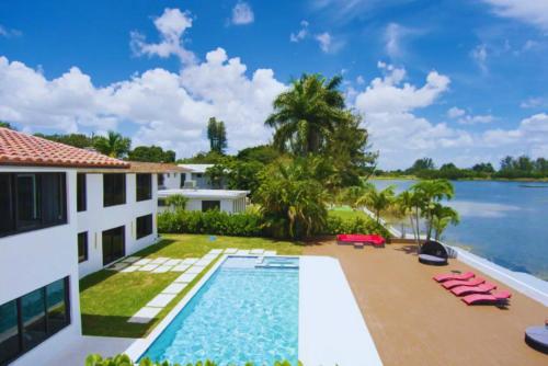 an aerial view of a villa with a swimming pool at Club House 305 w PRIVATE NIGHTCLUB, Cinema, Game Room, Gym & Pool in Miami