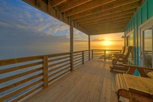 a balcony of a house with a view of the ocean at Waterfront w Bay Views Shared Pool Boat Dock Marlin Madness by AvantStay in Padre Island