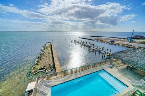 an aerial view of a swimming pool and the ocean at Waterfront w Bay Views Shared Pool Boat Dock Marlin Madness by AvantStay in Padre Island