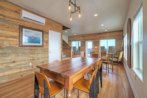 a dining room with a wooden table and chairs at Waterfront w Bay Views Shared Pool Boat Dock Marlin Madness by AvantStay in Padre Island