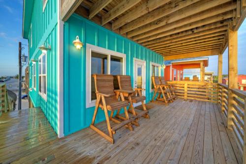 a deck with chairs on a green house at Waterfront w Bay Views Shared Pool Boat Dock Marlin Madness by AvantStay in Padre Island