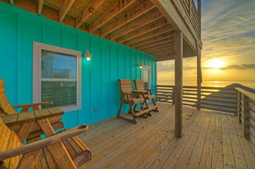 a porch of a house with a view of the ocean at Waterfront w Bay Views Shared Pool Boat Dock Marlin Madness by AvantStay in Padre Island