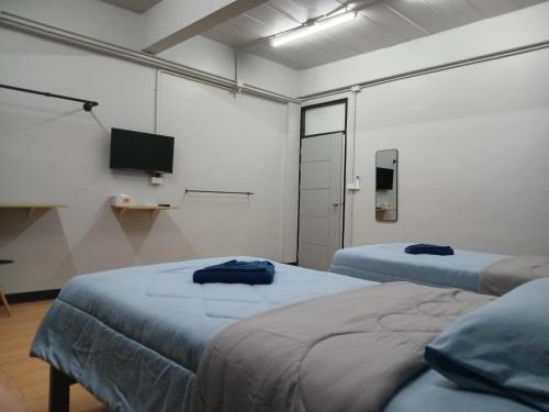 Ένα ή περισσότερα κρεβάτια σε δωμάτιο στο Baanpru daily room