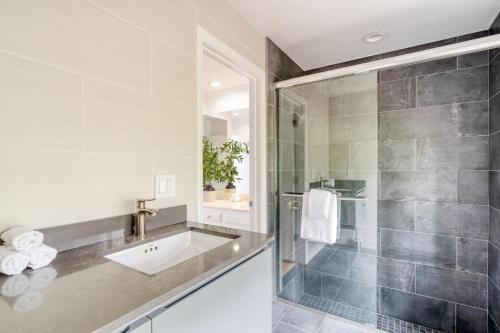a bathroom with a sink and a shower at Malvasia by AvantStay Luxe Wine Country Retreat in Santa Rosa