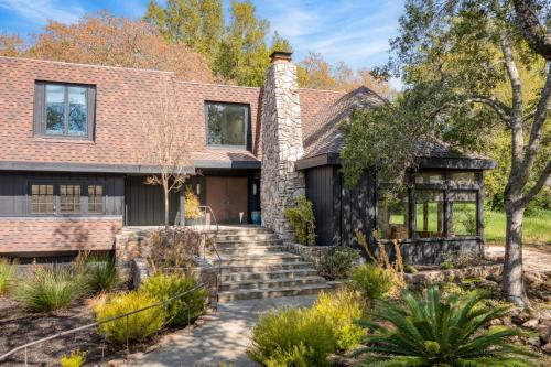 a brick house with a stone chimney at Malvasia by AvantStay Luxe Wine Country Retreat in Santa Rosa