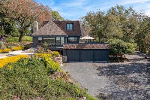 a house with a garage and a driveway at Malvasia by AvantStay Luxe Wine Country Retreat in Santa Rosa