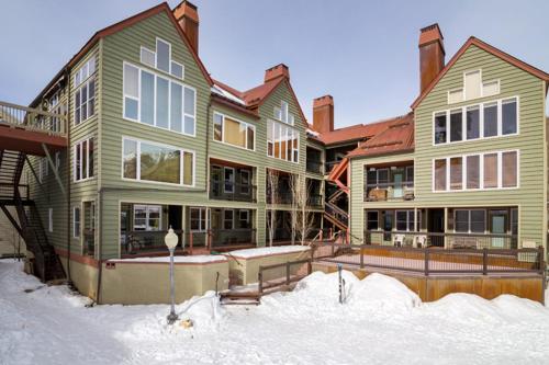a large house with snow in front of it at Etta Place 1 by AvantStay Ski In Ski Out Unit w Views of the Slopes in Telluride