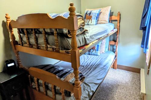 a wooden bunk bed in a room at Frost Hollow by AvantStay Deck w Grill Game Room Loft in White Haven