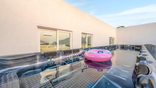a pink boat sitting on the edge of a swimming pool at GYEONGJU LINEVIEW POOLVILLA in Gyeongju