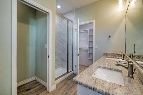 a bathroom with a sink and a shower at Boat Dock Pool Private Fishing Village Roseate Spoonbill by AvantStay in Padre Island