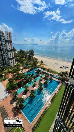 an aerial view of a resort swimming pool and the beach at Sea View & Pool View & WiFi & Netflix at Iman Kazoku TimurBay Ville Studio 2BDR in Kuantan