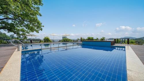 a swimming pool on the roof of a house at Namhae Familyae Pension in Namhae