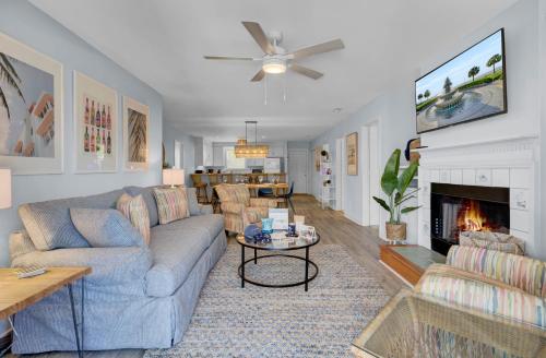 a living room with a couch and a fireplace at Ion by AvantStay Walk to Beach Dining Shopping Central Location Deck in Sullivans Island