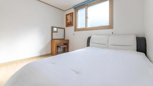 Postel nebo postele na pokoji v ubytování Gapyeong Mois