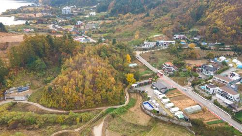 an aerial view of a town on a hill at Gapyeong Cheongchun Glamping & Caravan in Gapyeong