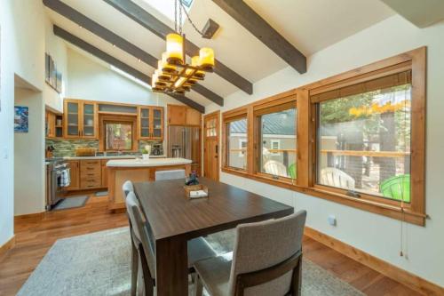a kitchen with a dining room table and chairs at Henderson by AvantStay Lake View Walk to Beach Garwoods More in Carnelian Bay
