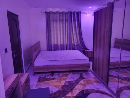 En eller flere senge i et værelse på Konde Guest