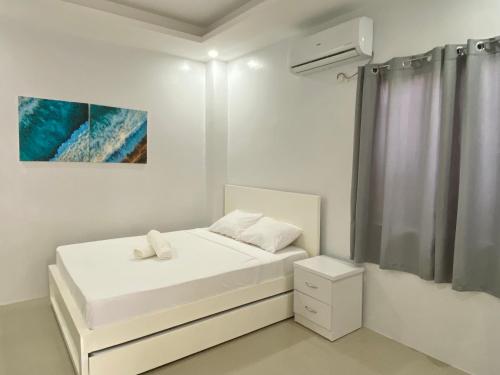 Postel nebo postele na pokoji v ubytování Christela Beach House