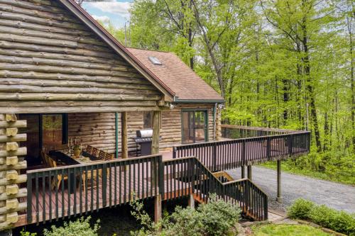 a log cabin with a porch and a deck at Half Moon by AvantStay 4BR Cabin w Large Deck Yard w Patio Outdoor Dining in Great Barrington