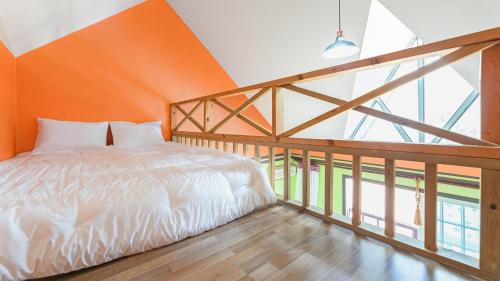 Postel nebo postele na pokoji v ubytování Gapyeong Dochi Vill Pension