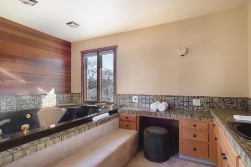 a large bathroom with a tub and a sink at Gable by AvantStay Beautiful 3.5 Acre Oasis w Gorgeous Views Pool Hot Tub in Santa Rosa