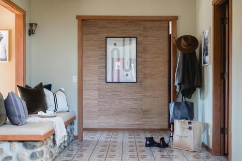 a room with a door with a bed and a bag at Gable by AvantStay Beautiful 3.5 Acre Oasis w Gorgeous Views Pool Hot Tub in Santa Rosa