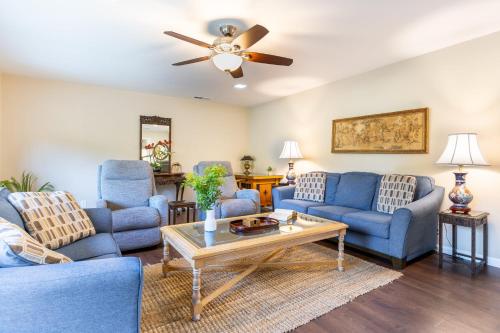 a living room with blue couches and a table at East Valley Manor by AvantStay Minutes to the Beach in Montecito