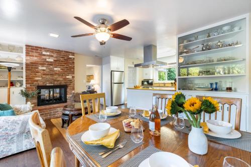a kitchen and dining room with a table and a ceiling fan at East Valley Manor by AvantStay Minutes to the Beach in Montecito