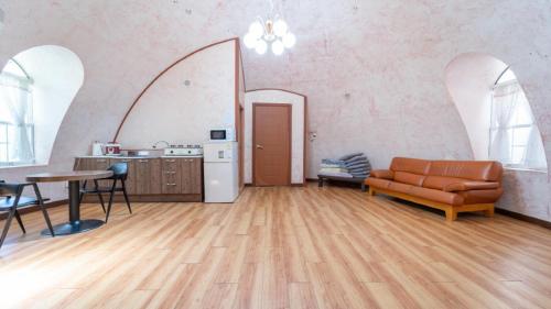 a living room with a couch and a table at Yangpyeong santa pension in Yangpyeong