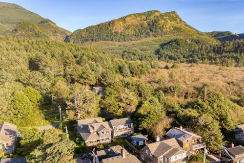 an aerial view of a home in the mountains at Royal Canoe by AvantStay Walk to the Shore Private Yard in Arch Cape