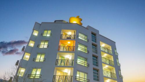 a building with a apple on the top of it at Gapyeong Applerotgi Pension in Gapyeong