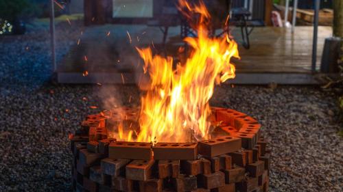 a fire pit made of bricks on the ground at Gapyeong Yumyeongsan Gomone pet Camping in Gapyeong