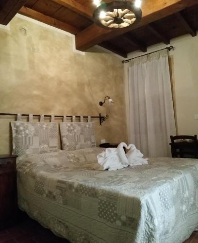 a bedroom with a bed with swans on it at La Casa Delle Rondini in Roncoferraro