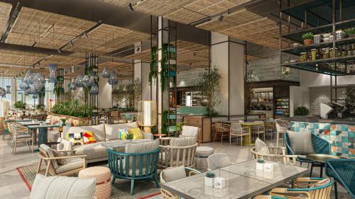 an interior rendering of a restaurant with tables and chairs at Rove Al Marjan Island in Ras al Khaimah