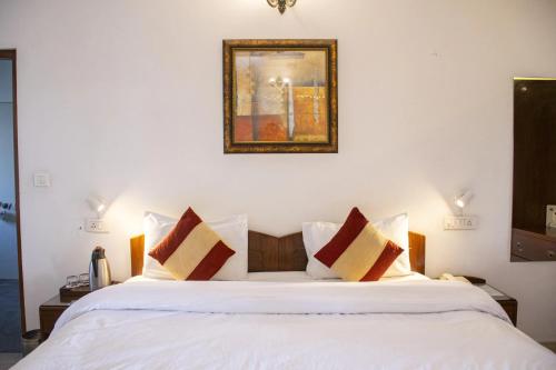 Postel nebo postele na pokoji v ubytování Shivashray Homestay