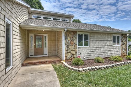 a house with a front door and a yard at Shades of Summer by AvantStay Gazebo Dock View in Cornelius