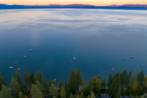 an aerial view of a large lake with boats at Homewood Lakefront by AvantStay Private Beach Lake Access Views in Homewood