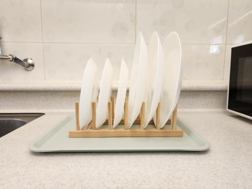 a display of white knives on a counter in a kitchen at Gyedong byeolchae, Bukchon hanok village & Namsan tower city view Warm morning sunshine Tranquil Rest in Seoul