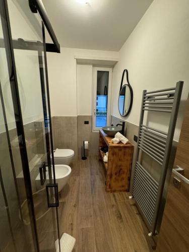 a bathroom with a sink and a toilet and a mirror at TIME To ESCAPE 3 in Tirano