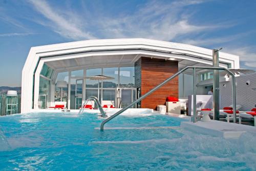 a swimming pool on top of a building at Gran Hotel Nagari Boutique & Spa in Vigo