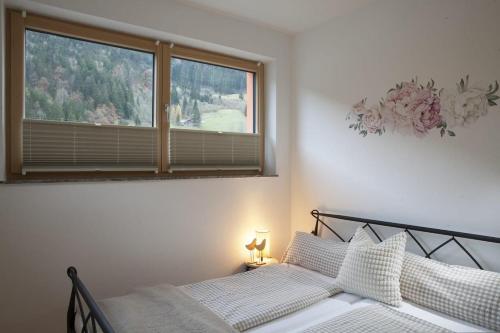 Postel nebo postele na pokoji v ubytování Appartement Sonnenhalb
