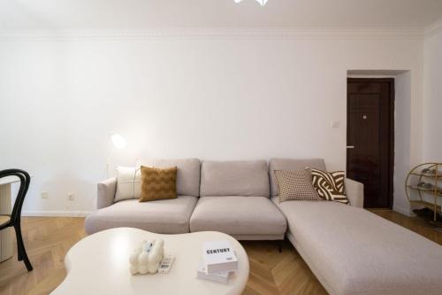 a living room with a couch and a table at Tonight Homestay West Nanjing Road Shanghai in Shanghai
