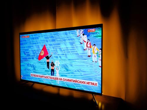 TV a/nebo společenská místnost v ubytování Casa de Raduga West