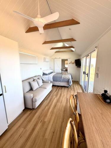 a living room with a couch and a bed at The Bay overlooking Boston Island in North Shields