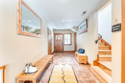 a hallway with a bench and stairs in a house at Ward Creek by AvantStay 5 Min Walk to Lake Deck in Tahoe City