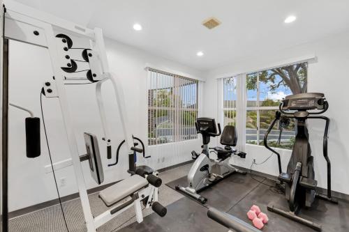 a gym with a treadmill and a elliptical machine at Encantamar Escape by AvantStay Prime Location Community Amenities in Dana Point