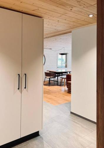 a room with two white cabinets and a dining room at Hidden Retreats 1466 Edition in Reichenbach