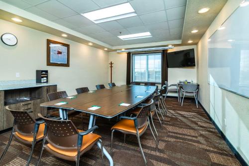 a conference room with a large table and chairs at Quality Inn & Suites in Moose Jaw